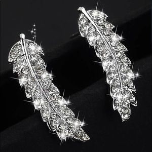 Rhinestone decor feathers stud earrings